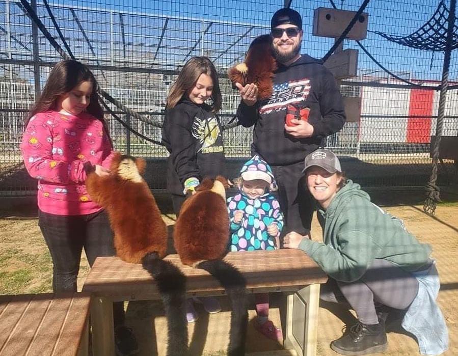 Family at ruffed lemur encounter