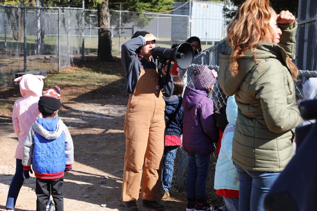 Guide at Sharkarosa Zoo with megaphone talking about animals.