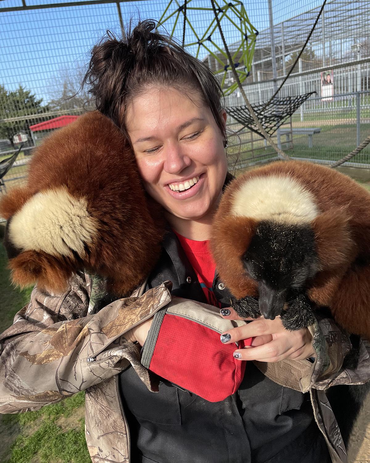 Lady with two Ruffed Lemurs